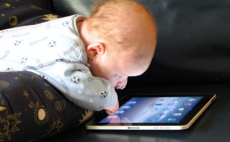 Baby playing with iPad